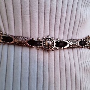 Leather belt with metal medallions